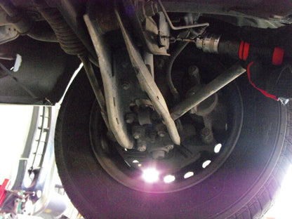 a close up of the front suspension of a vehicle