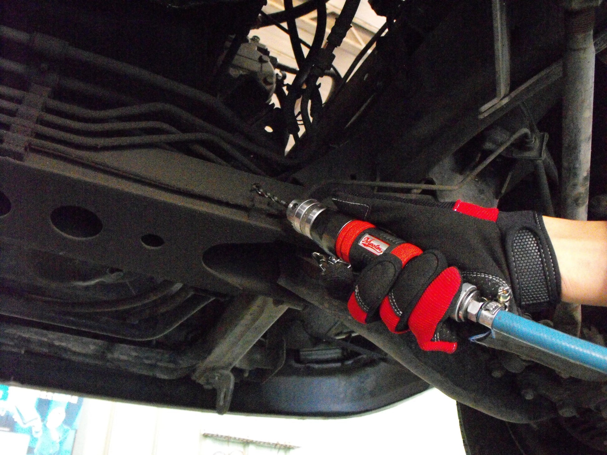 a man is working on a car under the hood