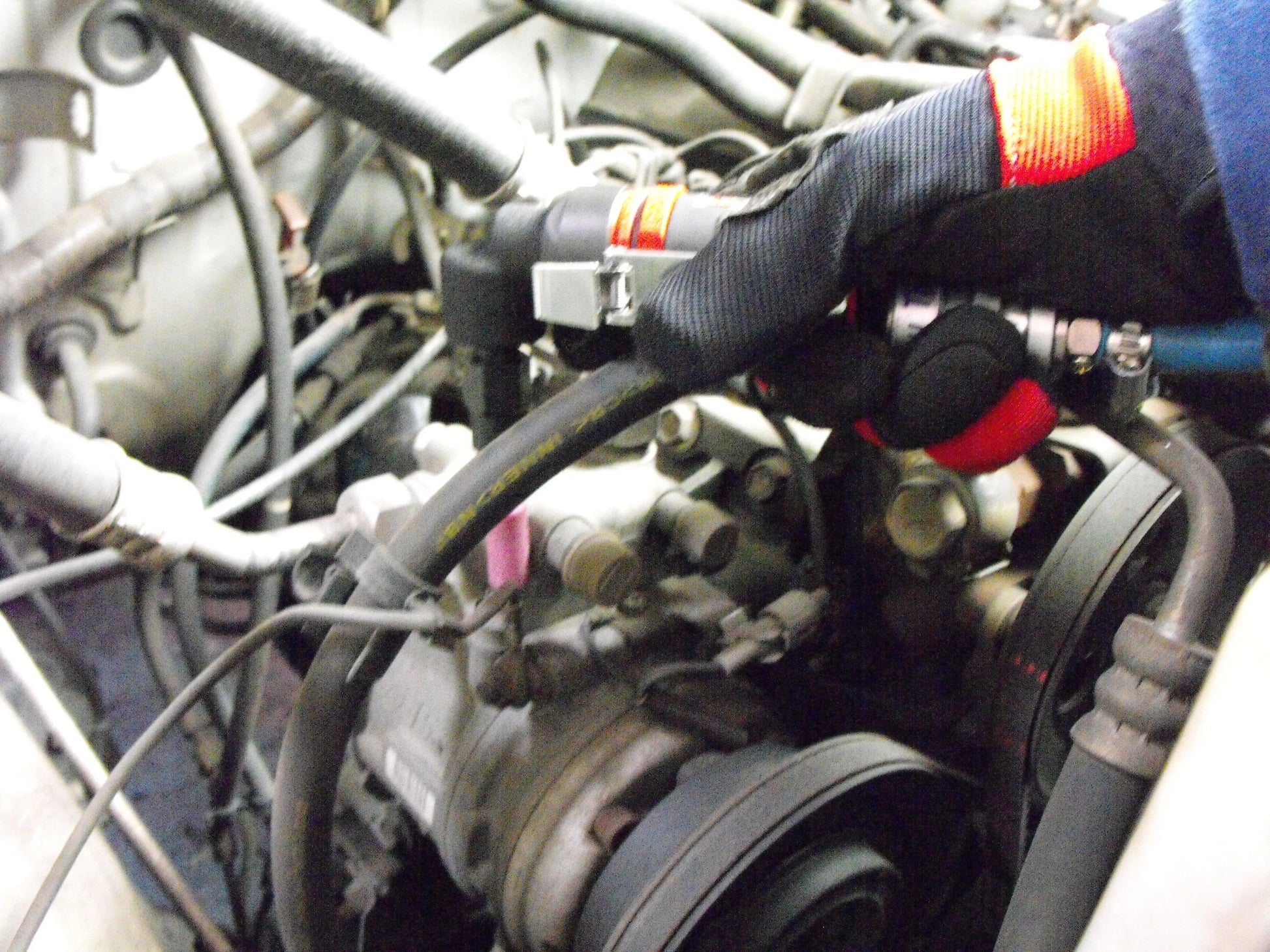 a close up of a person working on an engine