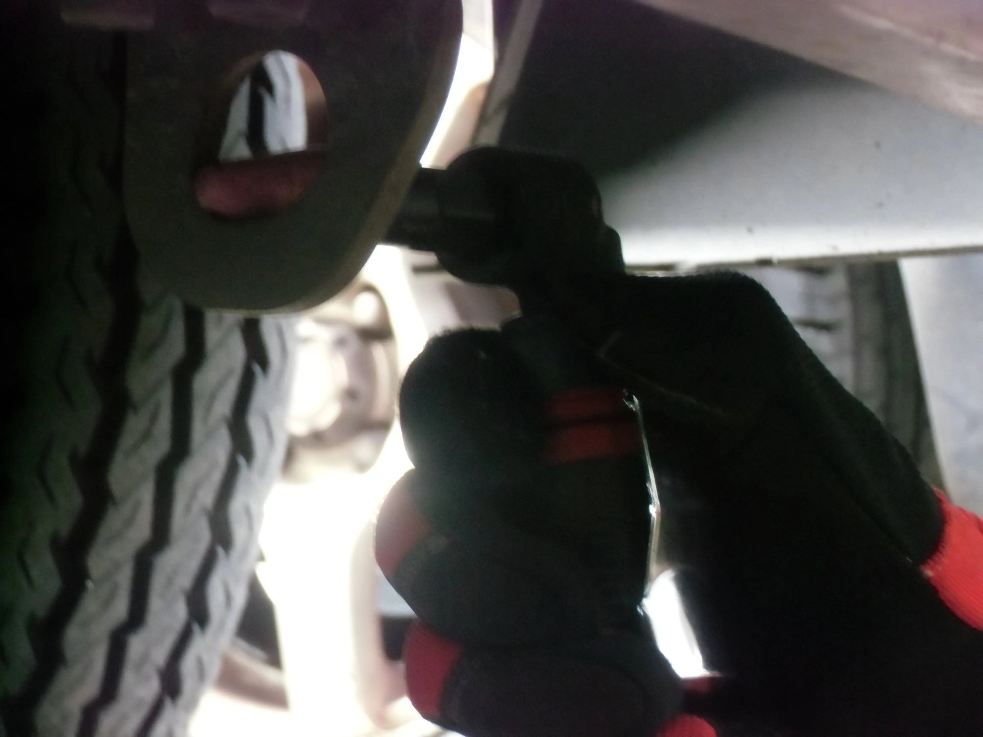 a close up of a person fixing a tire