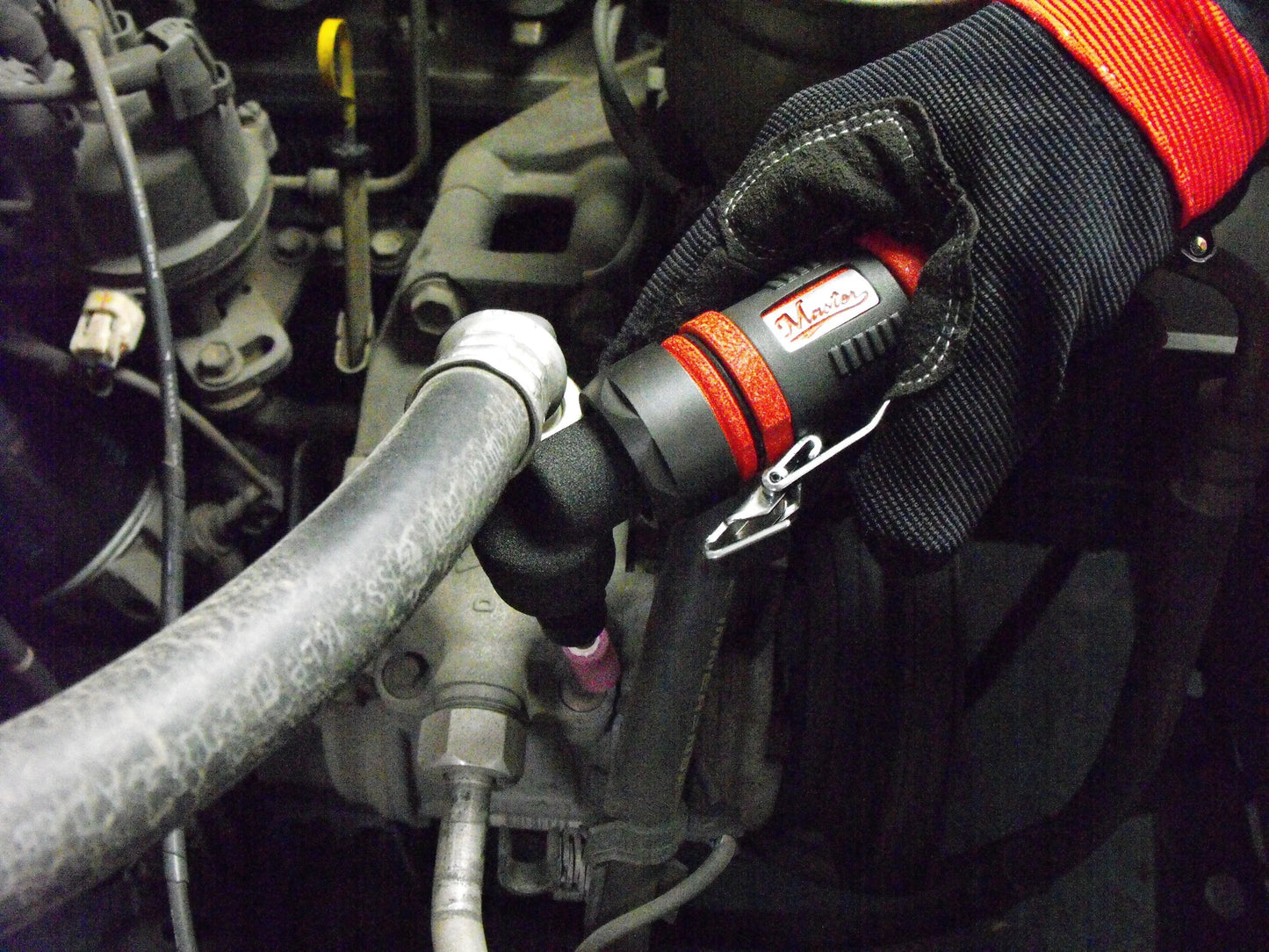 a close up of a person holding a hose