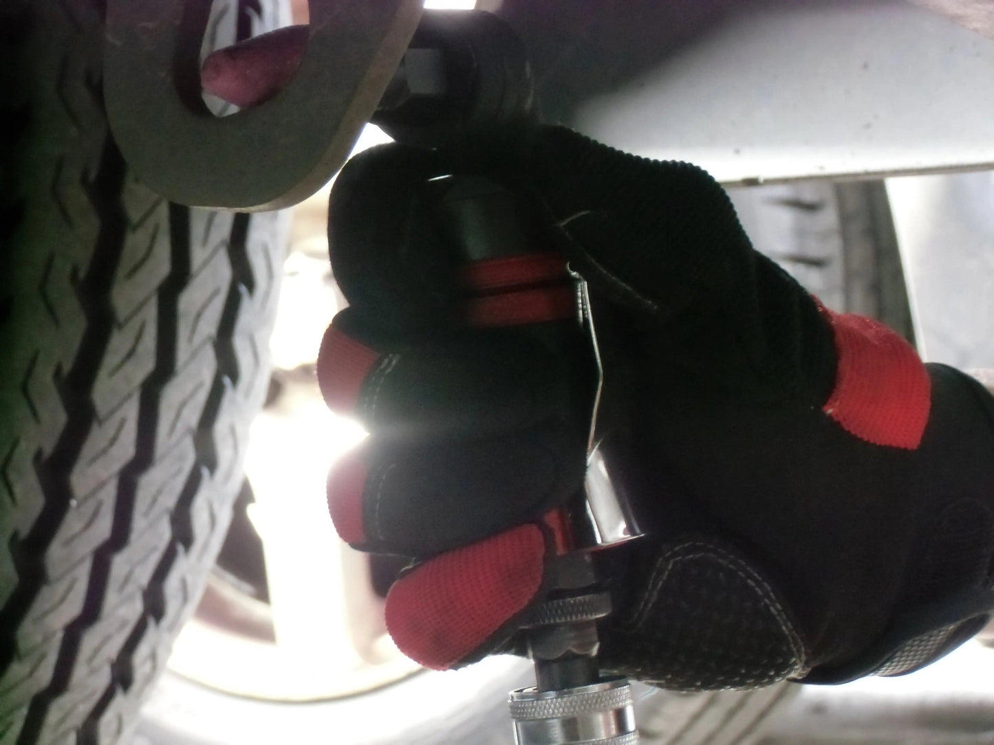 a close up of a pair of gloves on a bike